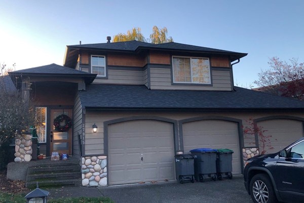 Black aluminum gutter replacement on two story home in Portland. OR