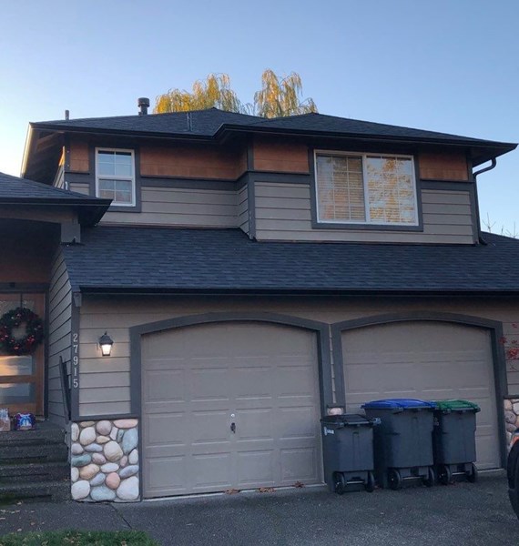Black aluminum gutter replacement on two story home in Portland. OR