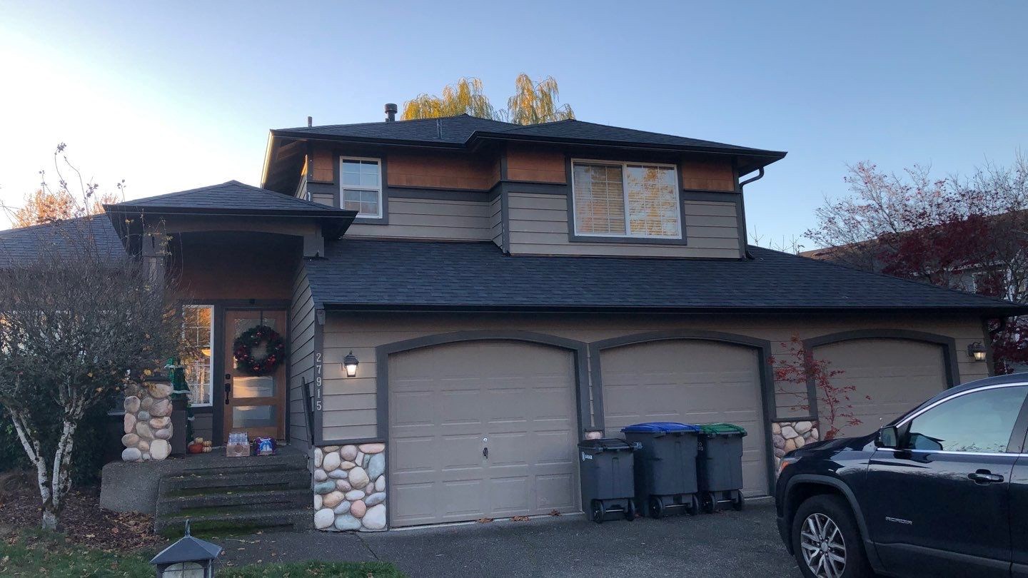 Black aluminum gutter replacement on two story home in Portland. OR