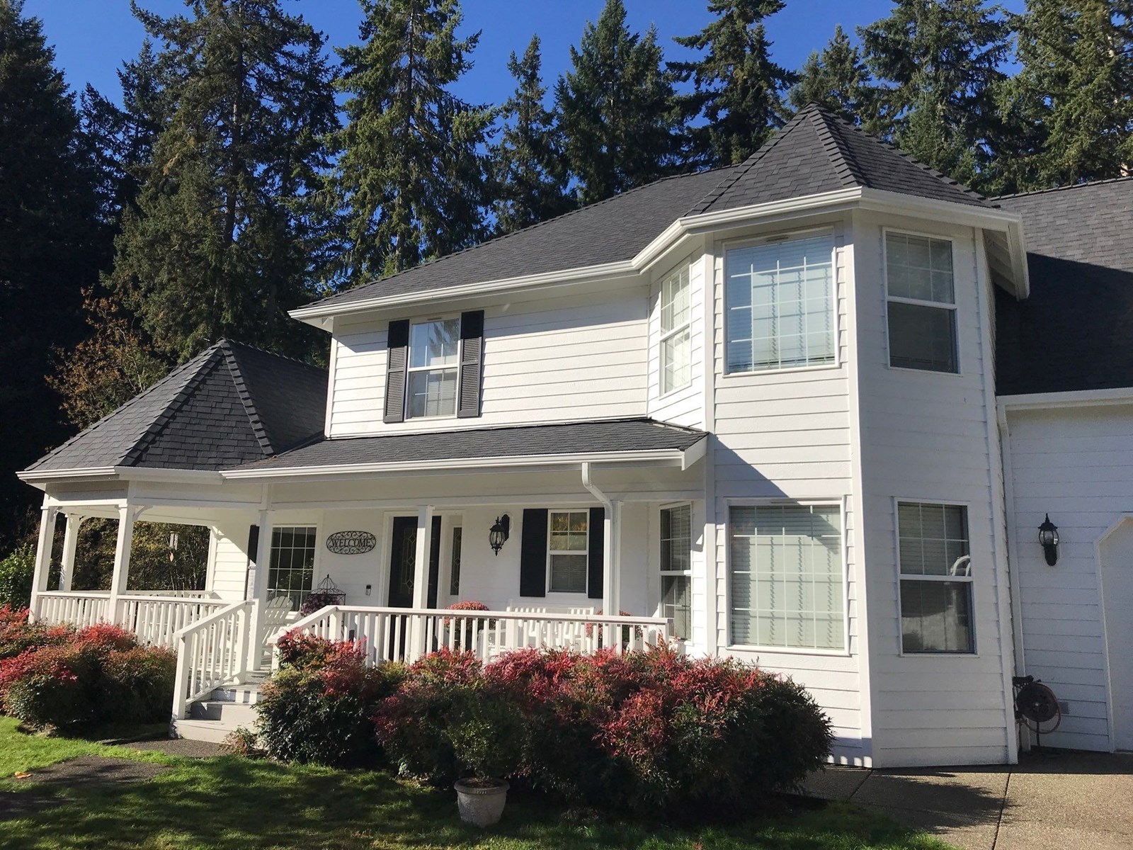 white steel gutters installed on roof awning in Vancouver, WA