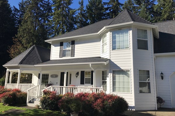 white steel gutters installed on roof awning in Vancouver, WA