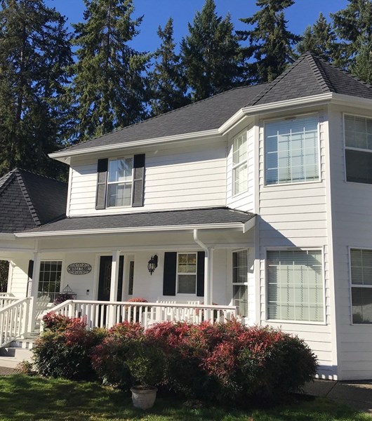 white steel gutters installed on roof awning in Vancouver, WA