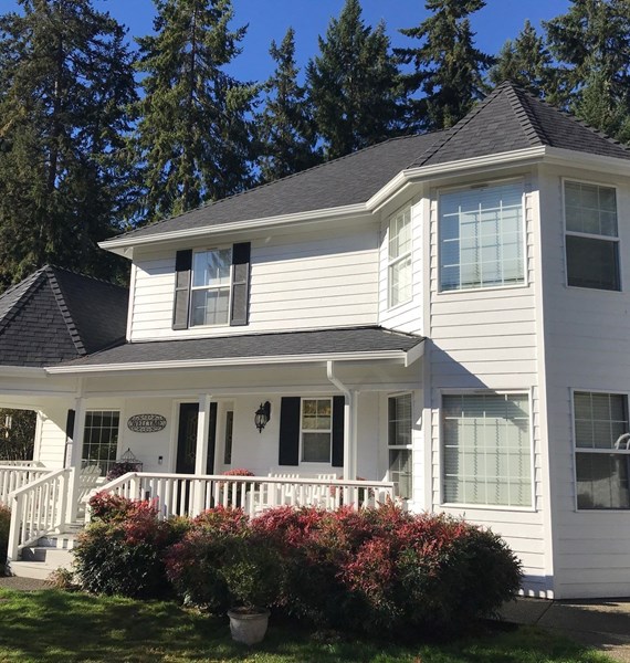 white steel gutters installed on roof awning in Vancouver, WA