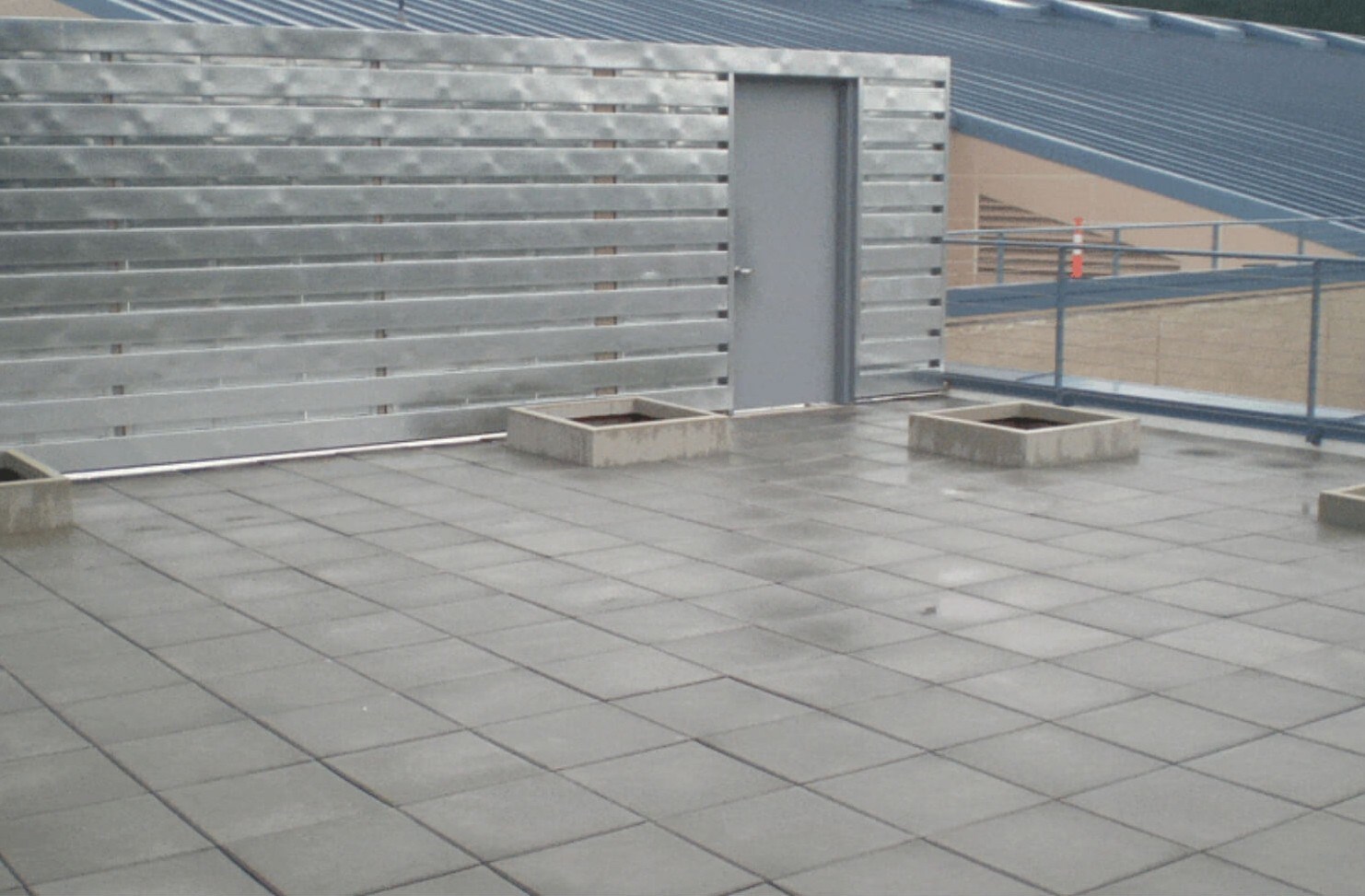 Commercial flat roof repair on industrial building in Portland, OR