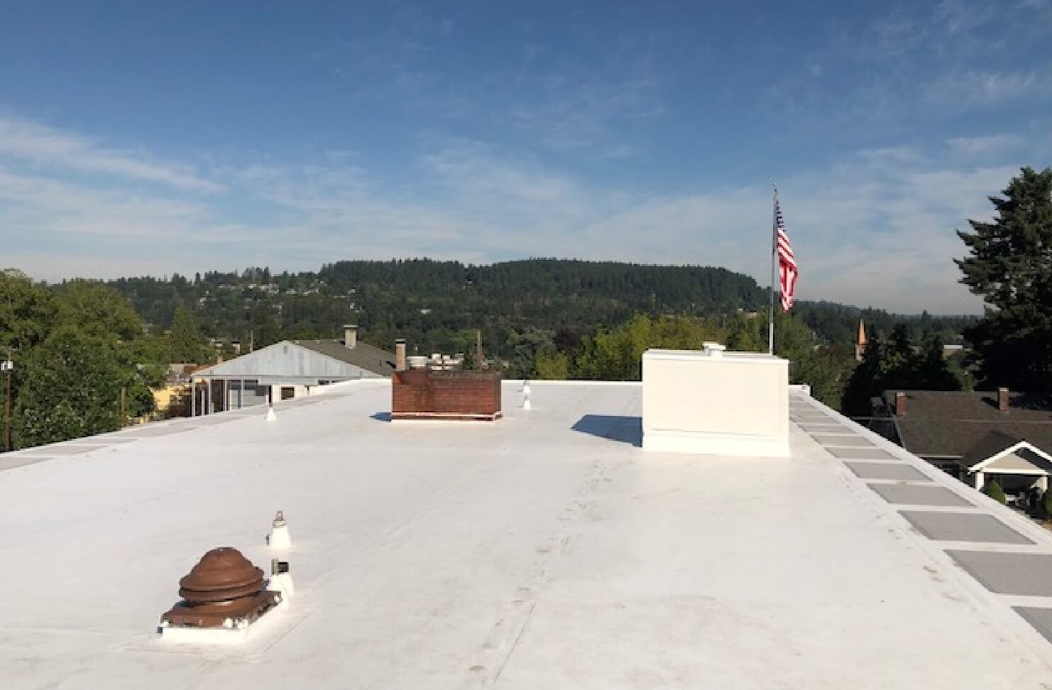 White TPO flat roof installtion on commmercial building in Portland, OR