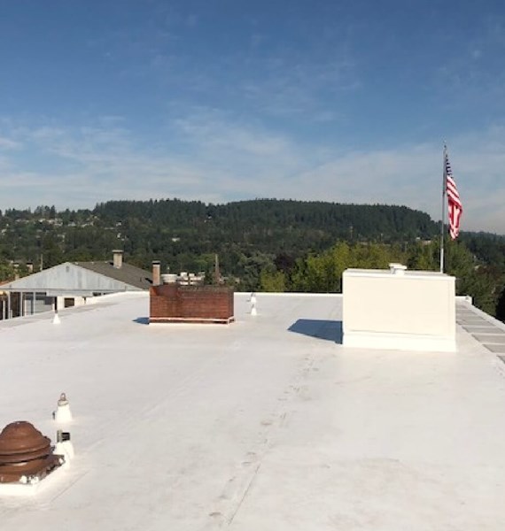 White TPO flat roof installtion on commmercial building in Portland, OR