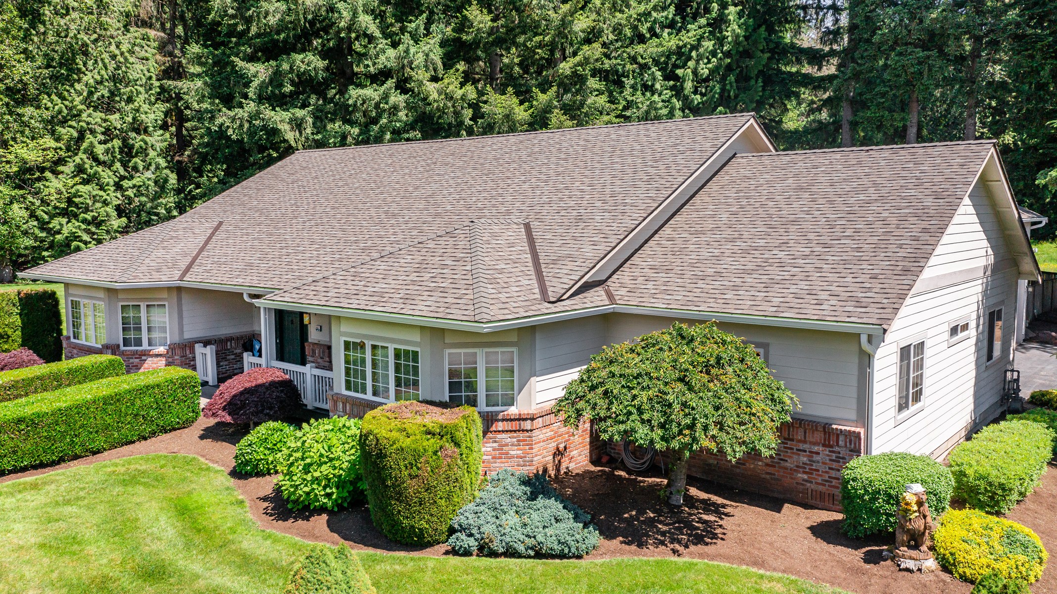 New, brown asphalt roof on one-story residential home in Portland, OR