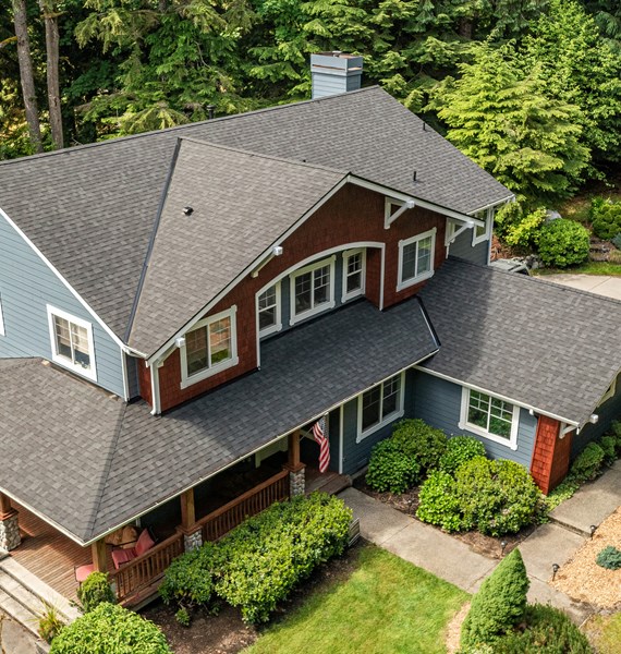 Black composite shingles on big two-story home near Portland, OR