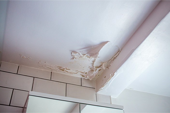 Paint peeling from ceiling from leaky roof